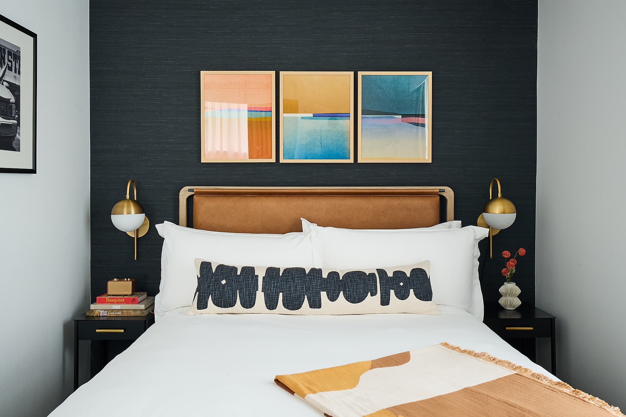 Wide shot of bed and nightstands at Rusk House Serviced Apartments in Houston