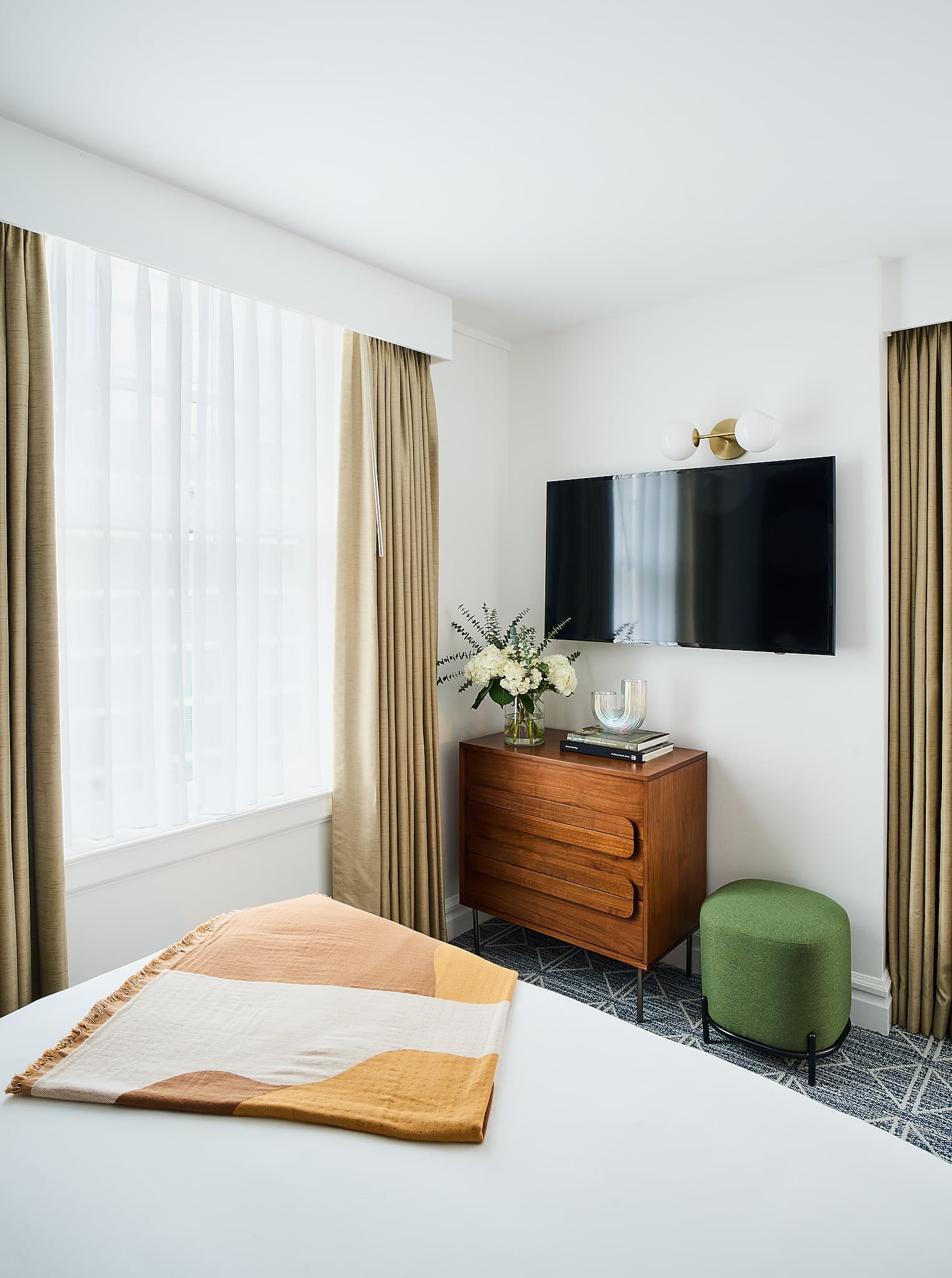 View of smart TV in bedroom at Rusk House Serviced Apartments in Houston