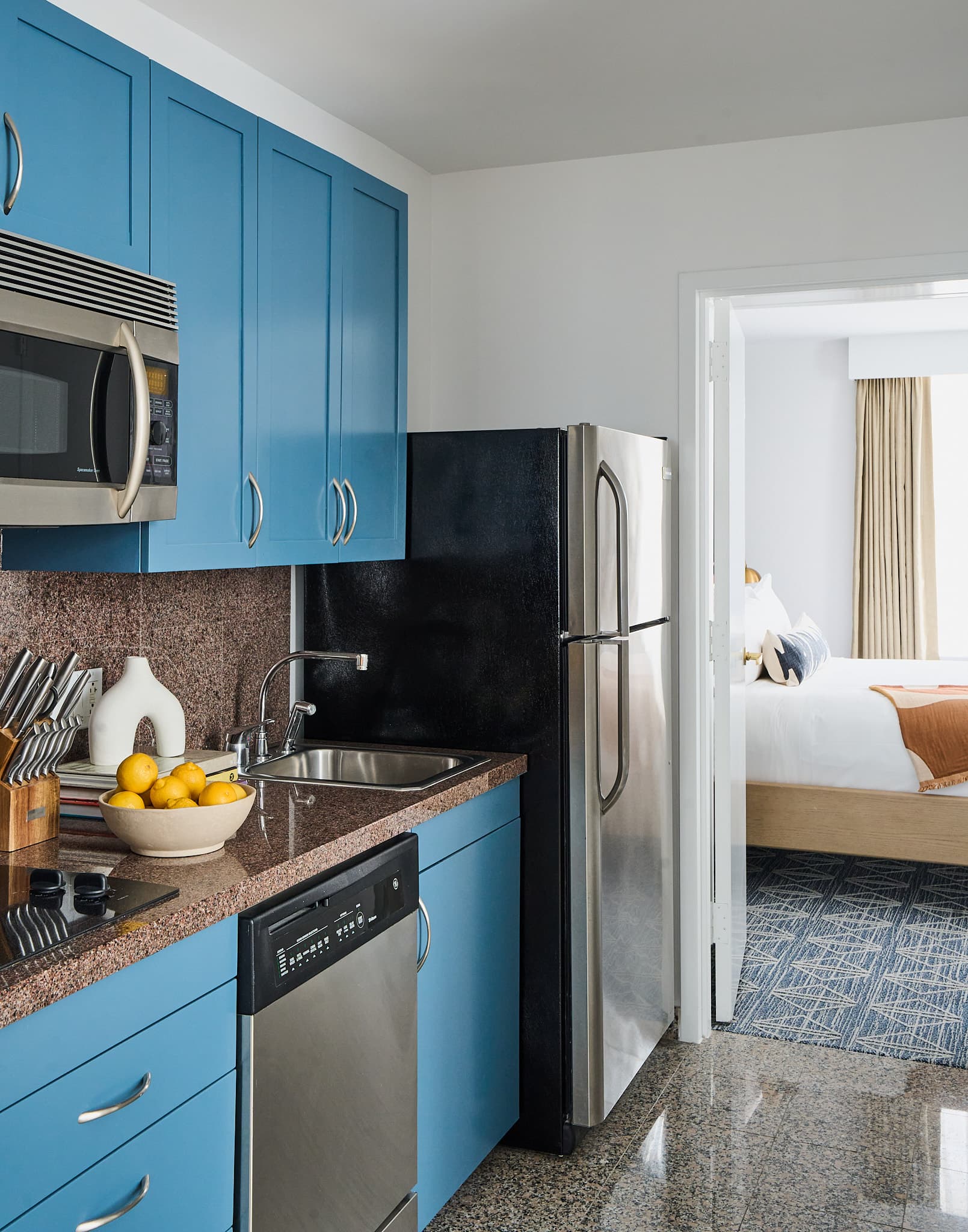 View of bedroom and kitchen from kitchen at Rusk House Serviced Apartments