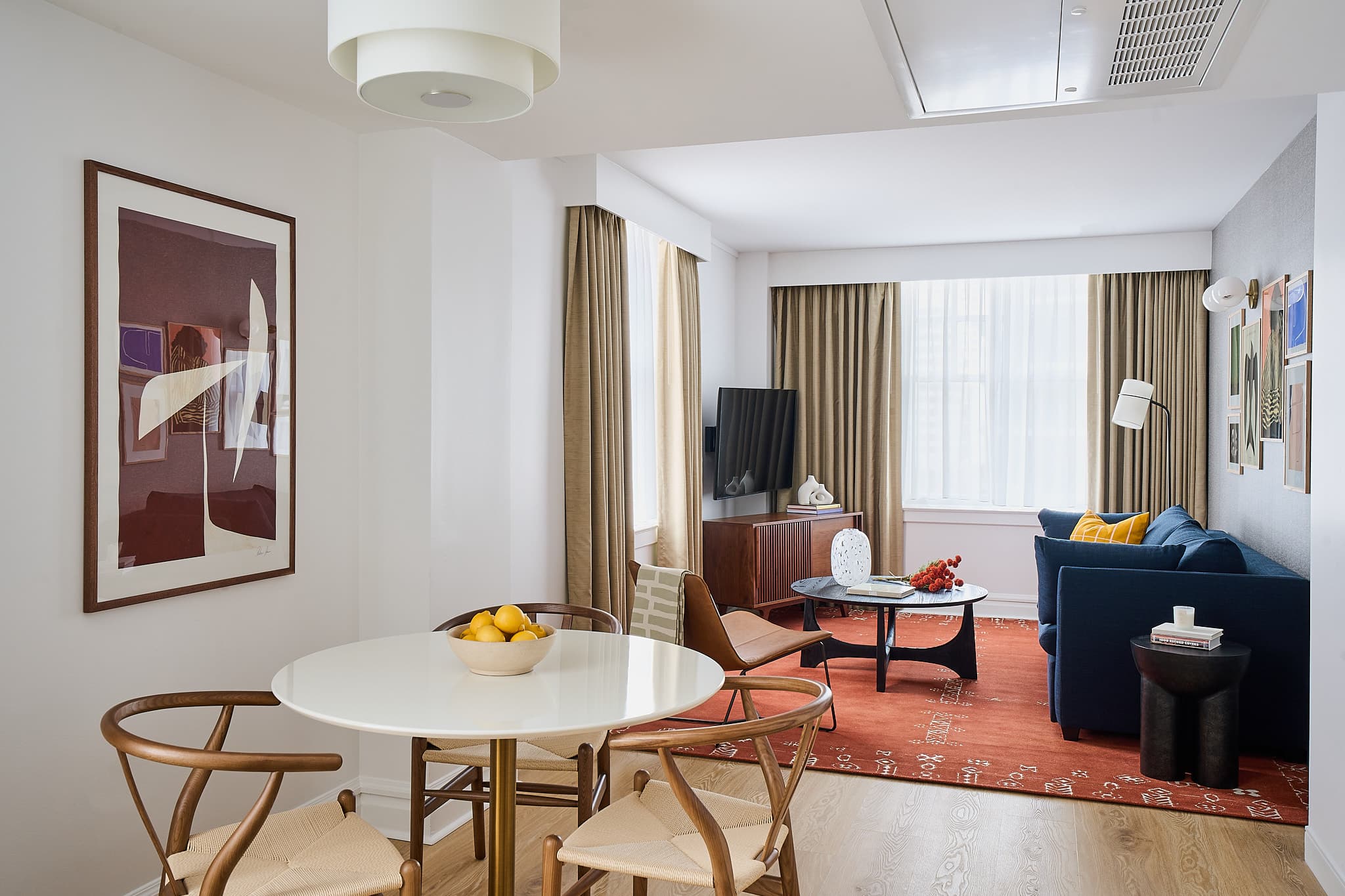 Dining and living area inside Houston apartment at Rusk House