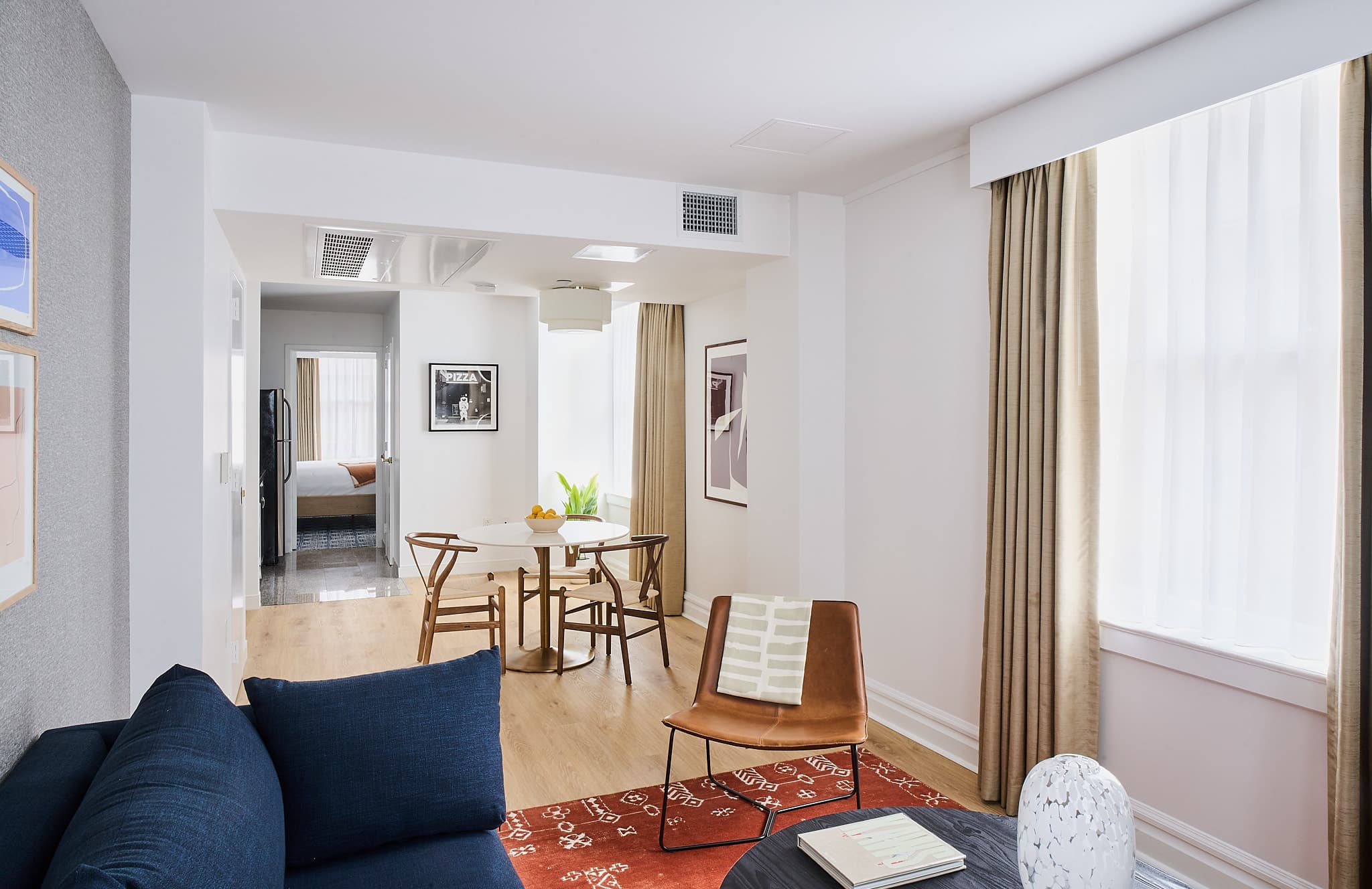 View of dining table for three inside Houston one-bedroom apartment from living room